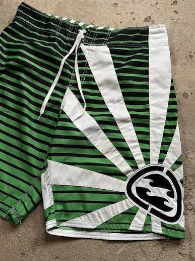 Kauaʻi Green Andy Irons-era boardshort reference in green / white / black